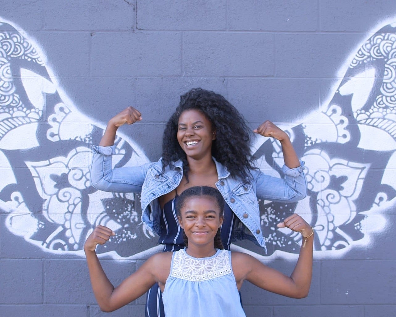 Mother and daughter with angel wings