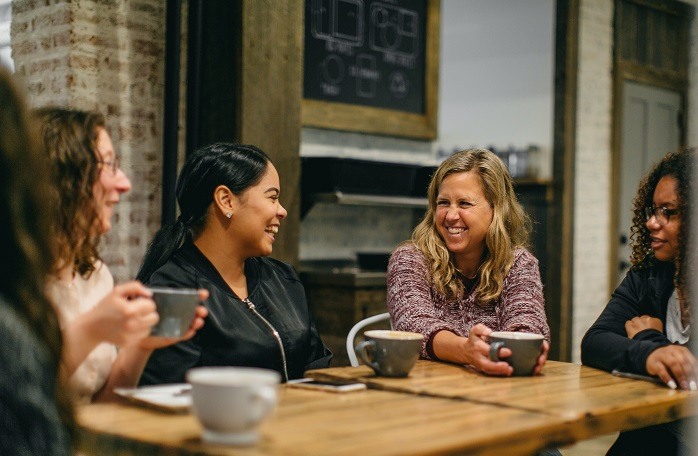 Bridge of Hope mom and her Neighboring Volunteers
